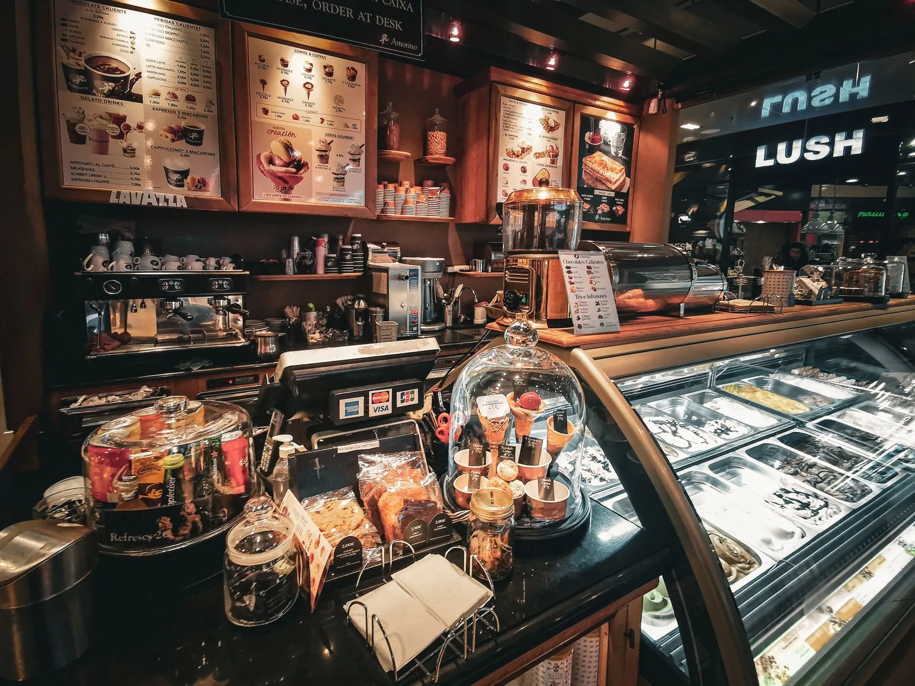 Coffee and desserts displayed at a cafe counter
