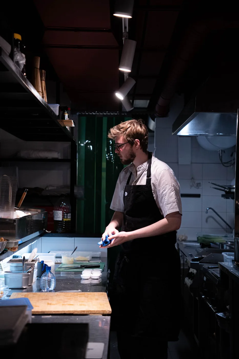 A chef preparing a meal in a restaurant kitchen