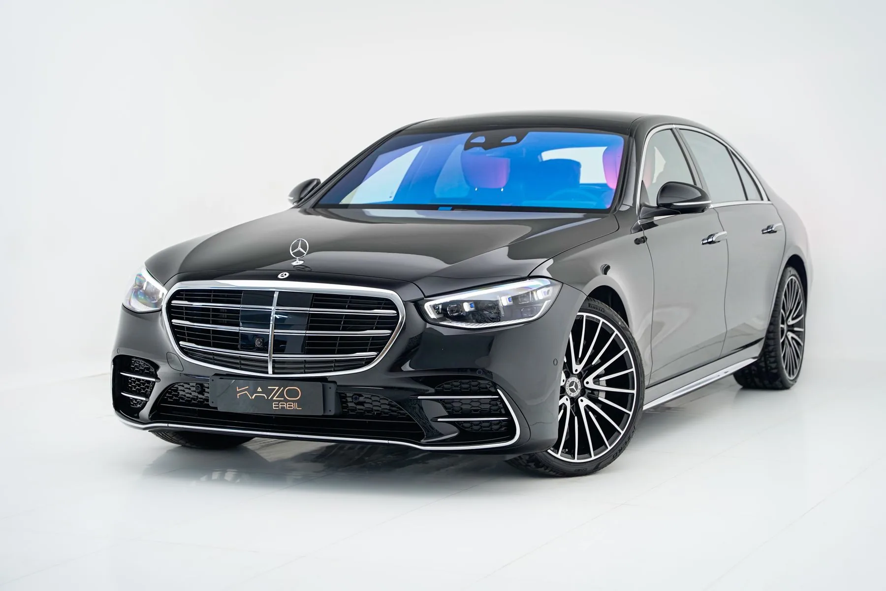 A black Mercedes-Benz S-Class sedan