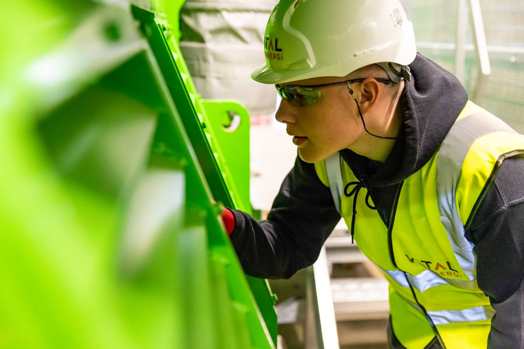 An engineer inspecting industrial machinery